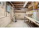 Unfinished basement displaying the home's infrastructure, offering potential for future customization at 3510 Chamberlin Dr, Indianapolis, IN 46237