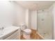 Basement bathroom featuring a sink, toilet, and shower, adding convenience and functionality at 3510 Chamberlin Dr, Indianapolis, IN 46237