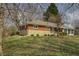 Charming brick home featuring a well-maintained lawn and mature trees at 3510 Chamberlin Dr, Indianapolis, IN 46237