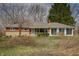 Charming brick home featuring a well-maintained lawn and mature trees at 3510 Chamberlin Dr, Indianapolis, IN 46237