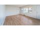 Bright living room with natural light, hardwood floors, and neutral paint at 3510 Chamberlin Dr, Indianapolis, IN 46237