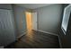 Bedroom with wood-look flooring, closet and window at 3519 N Whitcomb Ave, Indianapolis, IN 46224