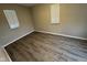 Bedroom features neutral paint and wood-look flooring at 3519 N Whitcomb Ave, Indianapolis, IN 46224