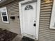 Close-up of the white front door with decorative window, mail box, and house number at 3519 N Whitcomb Ave, Indianapolis, IN 46224