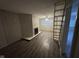 View of the cozy living room featuring a fireplace and hardwood floors at 3519 N Whitcomb Ave, Indianapolis, IN 46224