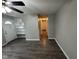 Living room featuring vinyl flooring and a view of the front door at 3519 N Whitcomb Ave, Indianapolis, IN 46224