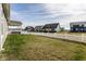 Spacious back yard with white picket fence and covered patio area perfect for outdoor gatherings at 3849 Sun Valley Dr, Westfield, IN 46074