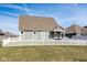 The fenced backyard features a covered porch and well-maintained lawn at 3849 Sun Valley Dr, Westfield, IN 46074