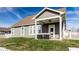 This covered porch has seating, ceiling fan, and a view of the lawn at 3849 Sun Valley Dr, Westfield, IN 46074
