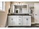 Bathroom with a long vanity, gray counter and framed mirror with lighting at 3849 Sun Valley Dr, Westfield, IN 46074