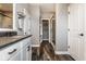 Bathroom with a walk in shower, long vanity with gray counter and dual sinks at 3849 Sun Valley Dr, Westfield, IN 46074