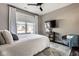 This charming bedroom features a ceiling fan, television and a sunlit window at 3849 Sun Valley Dr, Westfield, IN 46074