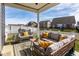 The covered patio is furnished with plush seating, a rug, and offers a cozy outdoor space at 3849 Sun Valley Dr, Westfield, IN 46074
