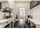 The entryway features a decorative mirror, coat hooks, storage, and hardwood floors at 3849 Sun Valley Dr, Westfield, IN 46074
