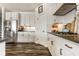 Well-lit kitchen featuring white cabinets, dark countertops, and stainless steel appliances at 3849 Sun Valley Dr, Westfield, IN 46074