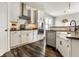Bright kitchen featuring white cabinets, stainless steel appliances, and a farmhouse sink at 3849 Sun Valley Dr, Westfield, IN 46074