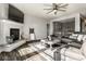Open concept living room with a fireplace, plush sofa, and lots of natural light at 3849 Sun Valley Dr, Westfield, IN 46074