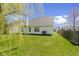 Spacious backyard featuring green lawn and air conditioning unit at 3856 Cornwallis Ln, Carmel, IN 46032