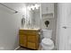 Cozy bathroom featuring a wood vanity, decorative mirror, and efficient toilet at 3856 Cornwallis Ln, Carmel, IN 46032
