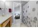 Bathroom featuring shower with patterned curtain visible from the vanity area at 3856 Cornwallis Ln, Carmel, IN 46032