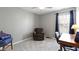 Cozy bedroom with soft carpet, a ceiling fan, and a well-lit workspace at 3856 Cornwallis Ln, Carmel, IN 46032