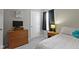 Cozy bedroom includes a bed, dresser, and soft carpet, perfect for restful nights at 3856 Cornwallis Ln, Carmel, IN 46032