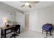 Comfortable bedroom with soft carpet, a ceiling fan, and a functional workspace at 3856 Cornwallis Ln, Carmel, IN 46032