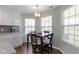 Cozy dining area with modern lighting and views of the outdoors at 3856 Cornwallis Ln, Carmel, IN 46032