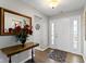 Spacious foyer with hardwood floors, a mirror, and a stylish entry table at 3856 Cornwallis Ln, Carmel, IN 46032