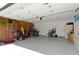 Spacious garage with storage shelves and room for parking at 3856 Cornwallis Ln, Carmel, IN 46032
