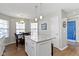 Open concept kitchen with an island, pendant lighting, and a dining area at 3856 Cornwallis Ln, Carmel, IN 46032