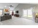 Bright living room with plush carpeting, a fireplace, and sliding glass doors at 3856 Cornwallis Ln, Carmel, IN 46032