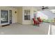 Relaxing porch featuring outdoor seating and a ceiling fan at 3856 Cornwallis Ln, Carmel, IN 46032
