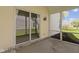 Screened porch featuring sliding glass door and concrete floor at 3856 Cornwallis Ln, Carmel, IN 46032