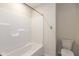 Bright bathroom featuring a tub and shower combination with a neutral color scheme and modern fixtures at 4016 Railhead Ave, Westfield, IN 46074