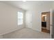 Cozy bedroom featuring neutral carpet, natural light and ensuite bath at 4016 Railhead Ave, Westfield, IN 46074
