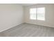This bedroom features neutral paint, soft carpeting, and a large window that brightens the room with natural light at 4016 Railhead Ave, Westfield, IN 46074