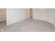Bright bedroom features neutral walls, plush carpeting, and an open door to an ensuite dressing room at 4016 Railhead Ave, Westfield, IN 46074