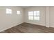 Bright bedroom with wood floors, large windows, and neutral wall color at 4016 Railhead Ave, Westfield, IN 46074