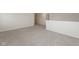 Spacious bonus room with neutral carpeting and paint, adjacent to an open hallway, creating an inviting atmosphere at 4016 Railhead Ave, Westfield, IN 46074
