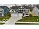 Attractive two-story home featuring a well-manicured lawn and a three-car garage, enhancing its curb appeal at 4016 Railhead Ave, Westfield, IN 46074