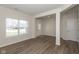 Inviting living room with wood floors and a view to the front door entrance at 4016 Railhead Ave, Westfield, IN 46074