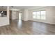 Bright living room featuring hardwood floors and natural light from a sliding door and window at 4016 Railhead Ave, Westfield, IN 46074