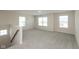 Upstairs loft area featuring neutral carpet, lots of light and open floor plan at 4016 Railhead Ave, Westfield, IN 46074