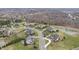 Aerial view of the neighborhood, showcasing houses, ponds and mature trees at 4429 Serengeti Cir, Carmel, IN 46074