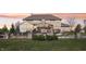 Backyard with outdoor stone fireplace and seating area at 4429 Serengeti Cir, Carmel, IN 46074