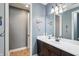 Well-lit bathroom with dark wood cabinetry, a white countertop, and baseball themed decorations at 4429 Serengeti Cir, Carmel, IN 46074