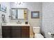 Stylish powder room featuring patterned wallpaper, a modern mirror, and sleek fixtures at 4429 Serengeti Cir, Carmel, IN 46074