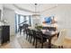 Elegant dining room with a chandelier, grand piano, and views of the outdoors at 4429 Serengeti Cir, Carmel, IN 46074