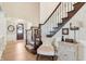 Inviting foyer with hardwood floors, elegant staircase, and decorative details at 4429 Serengeti Cir, Carmel, IN 46074